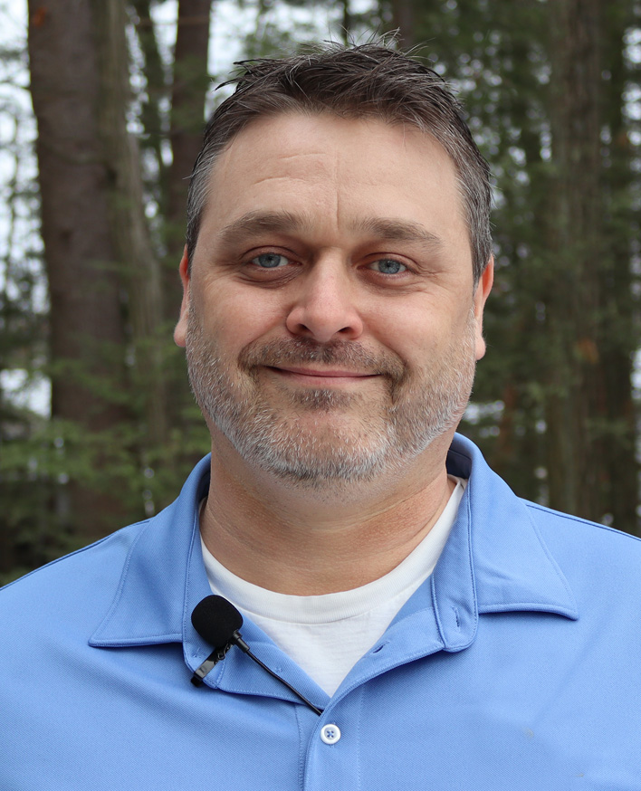 A portrait of a man with a gray beard