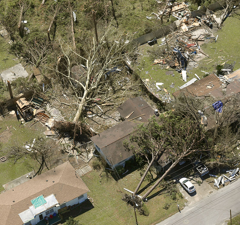 Damage to buildings, downed power lines, and toppled trees after Hurricane Michael left a swath of destruction across the Florida Panhandle.