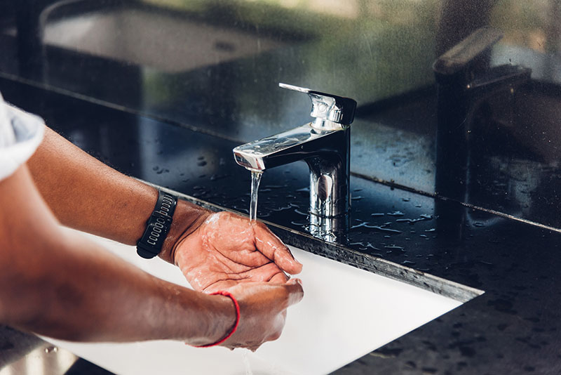 After pouring rubbing alcohol on the infected area to dissolve the urushiol oil, be sure to wash the area with soap and lukewarm water. Source: Adobe Stock