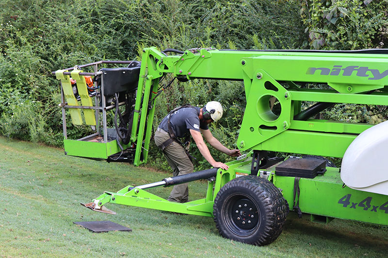 Uneven or rough terrain necessitates a lift with tracks, stabilizers, or outriggers to maintain balance. Source: Richard May