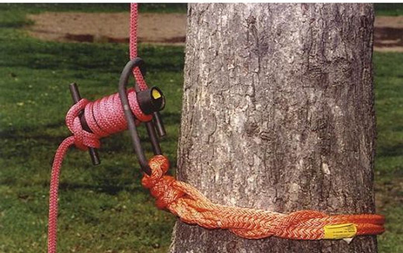 Anchor a port-a-wrap to the base of a tree with a whoopie or eye sling, and give it a couple wraps to lower heavy objects down with expert control. Source: TreeStuff