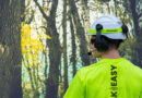 A tree worker communicates with this crew via wireless microphone and headphones.