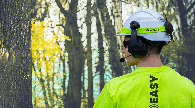 A tree worker communicates with this crew via wireless microphone and headphones.