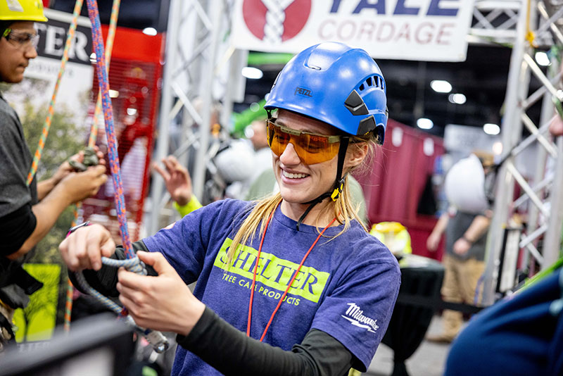 An arborist giving a knot tying demonstration at ArborEXPO.