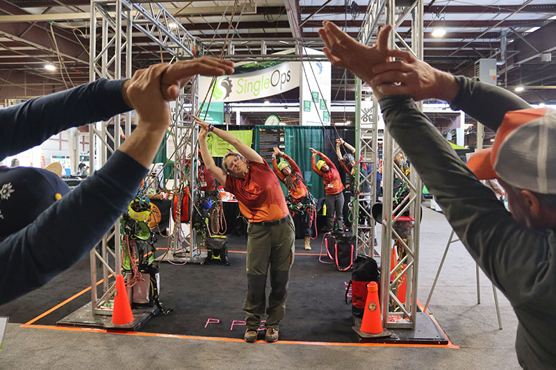 The Women’s Tree Climbing Workshop (WTCW) brought energy and education to the show floor with climbing demos, knot tying, yoga, and more.