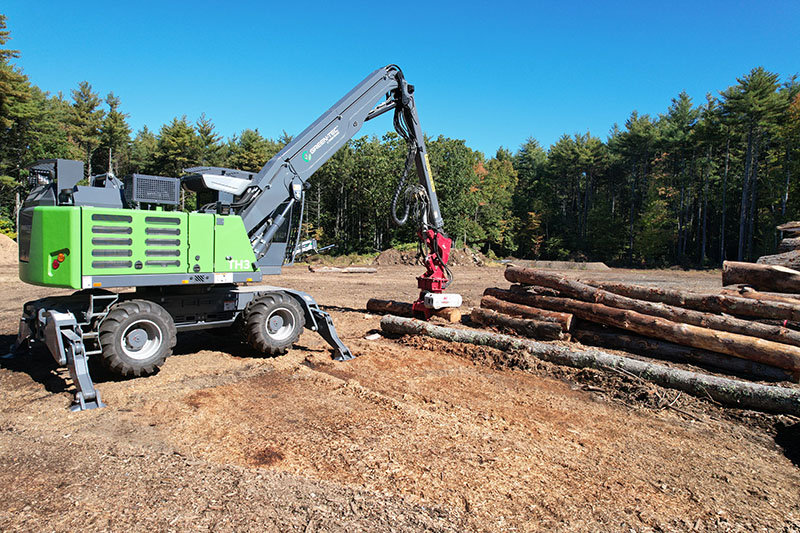 A tree handler like the TH3 Tree Handler from Green-Tec, seen here with a grapple saw, has a compact design with all-wheel steering that makes it a good option for working in confined spaces. Source: Green-Tec