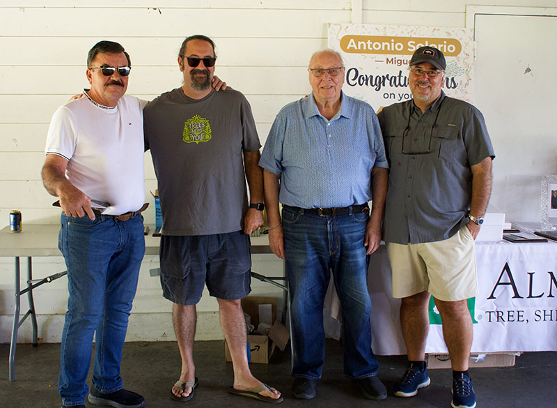 Freddy Martinez who was honored for 35 years of service to Almstead Tree, Shrub & Lawn Care. (L-R) Freddy Martinez, Michael Almstead (VP), Richard Almstead (founder) and Ken Almstead (CEO).